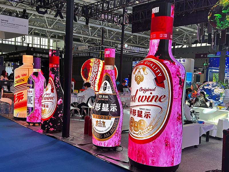 TOOSEN full exhibition booth with creative LED displays including bottle-shaped, Christmas tree, and diamond-shaped screens